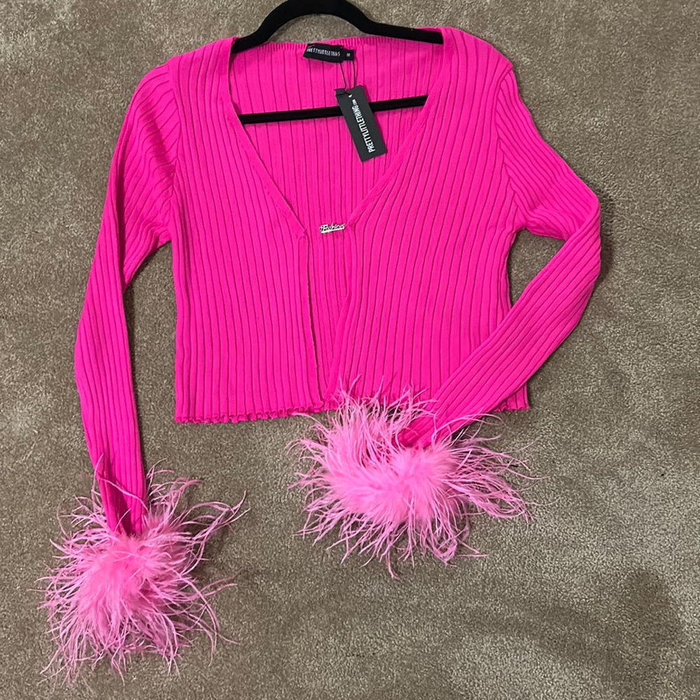 Pink cardigan with pink feathers